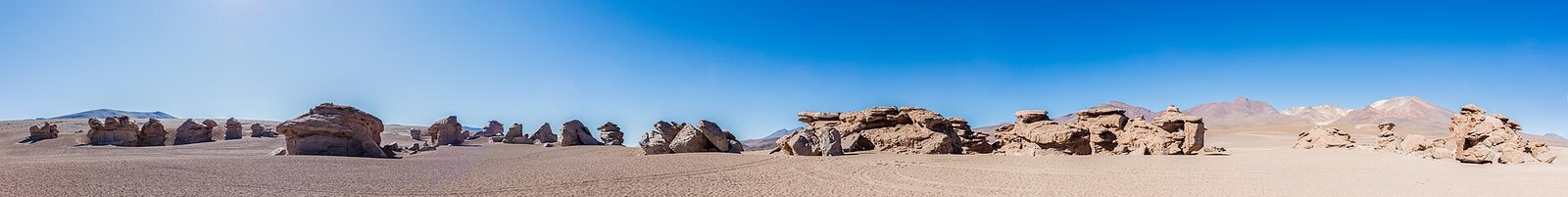 Panorama of the Siloli desert as the Uyuni tour climbs toward Laguna Colorada, where travelers sleep at high altitude