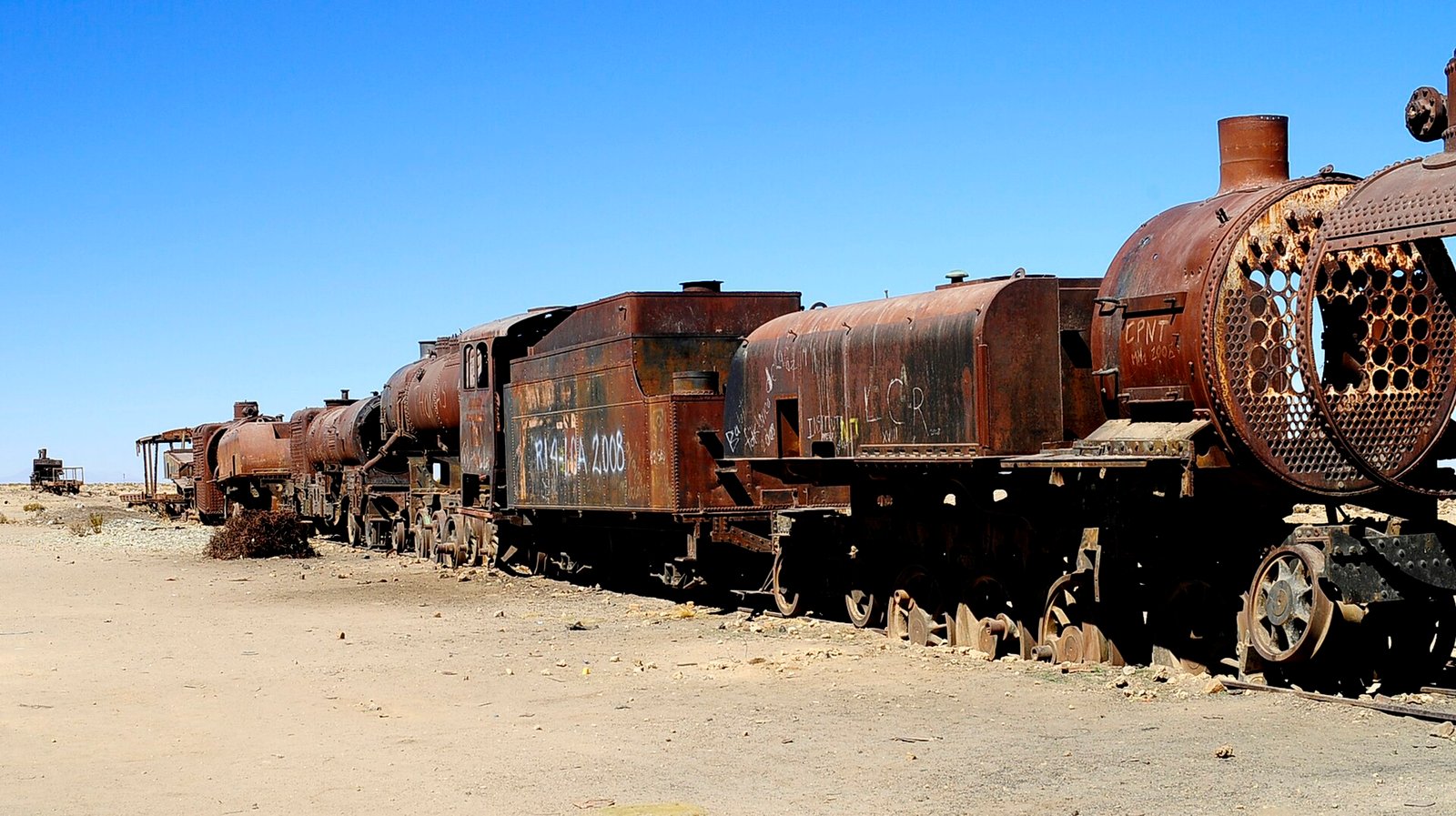 Rows of rusty train cars at the Uyuni train cemetery outside Uyuni, Bolivia